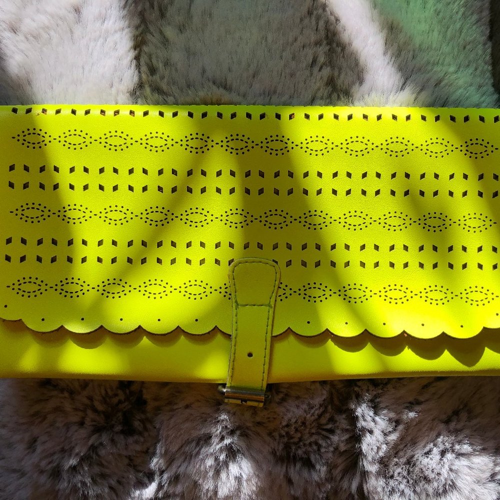 NWOT. Neon Eyelet Clutch
